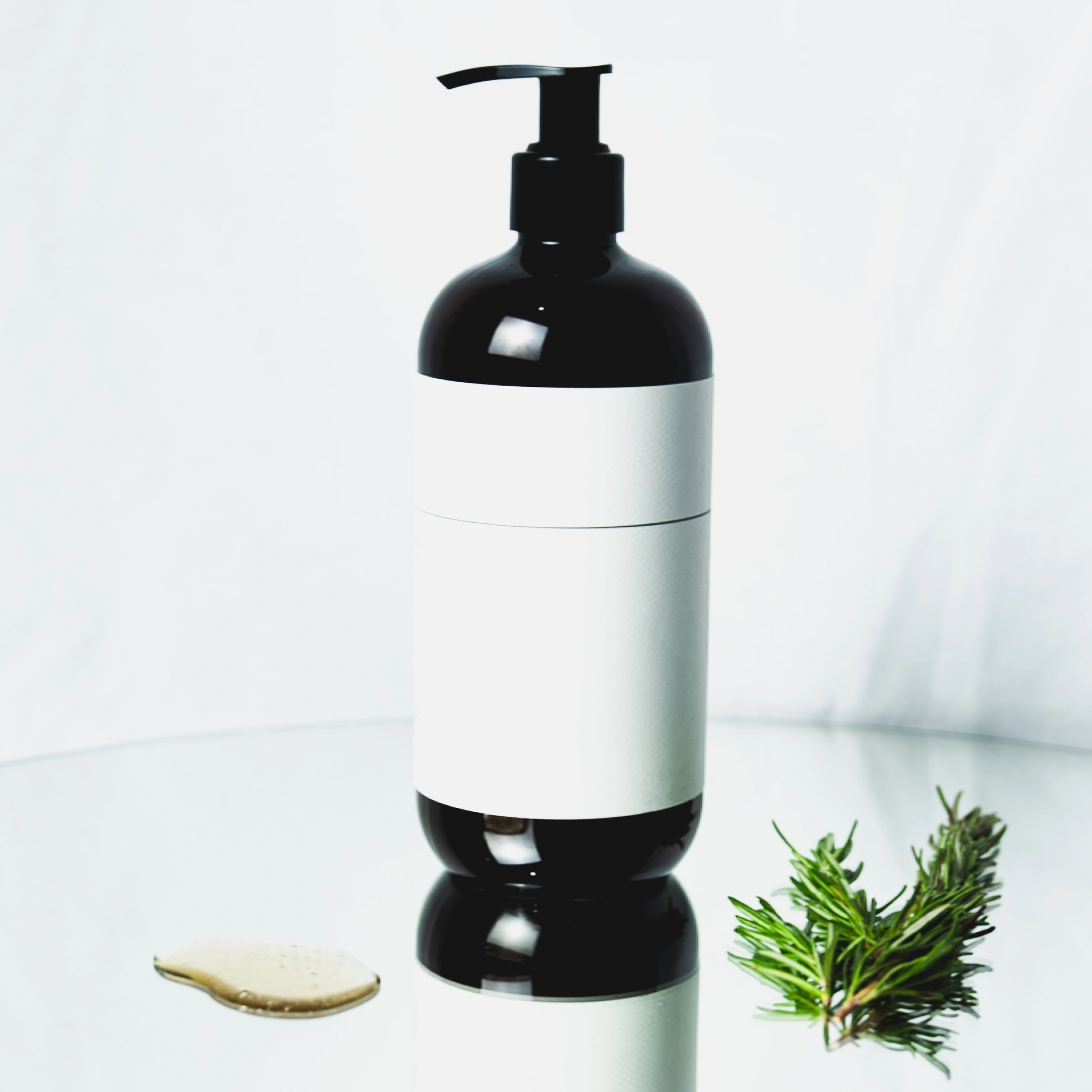 Skincare cream jar resting on a green leaf